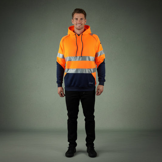A tradie wearing the Coopers Blizzard Hood hi-vis waterproof work jacket on-site